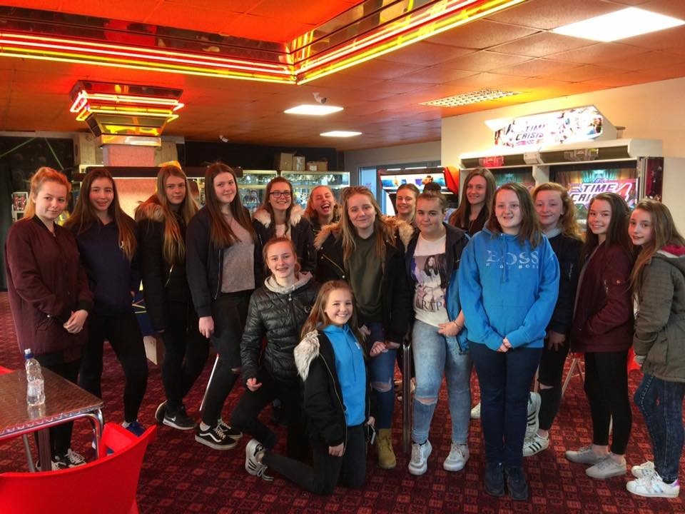 A group of young women together on an evening outing