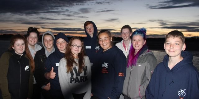 A group of young people together outdoors