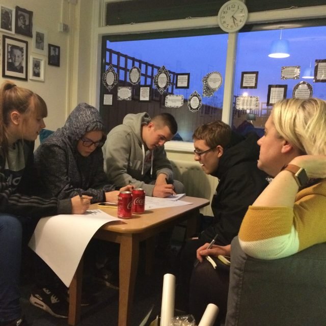 Young people at a D2 group session with a youth worker
