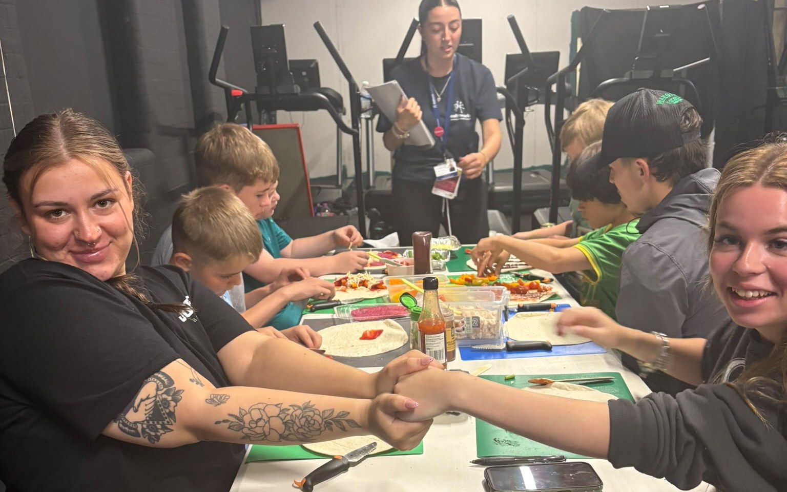Young people at a Jobes Boxing Gym holiday session making healthy wraps
