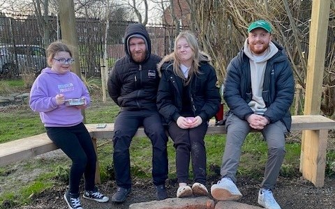 Greg with young people around the campfire at Projects 4 Change
