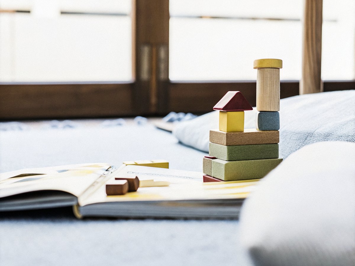 Colourful wooden toys and picture books in a bright nursery