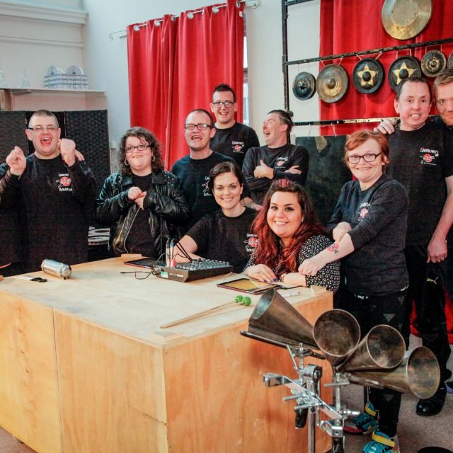 Members of the Lawnmowers percussion group with their instruments