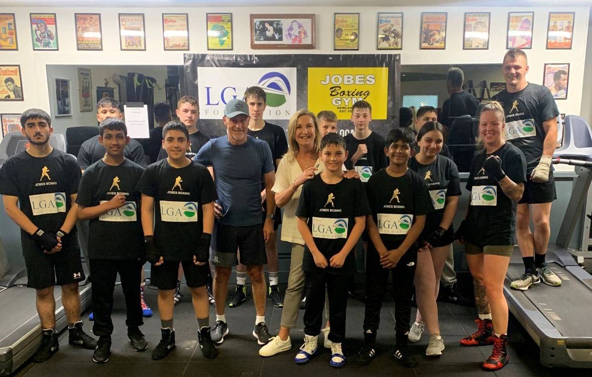 Sue and John Reece with a local team